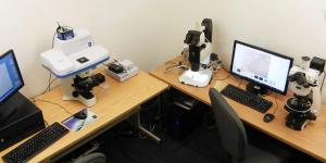 spectrometer and microscopes on workstation with computers