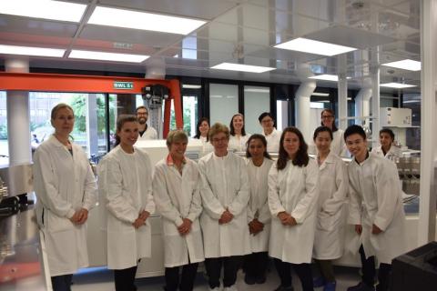 Lab group shot in white coats
