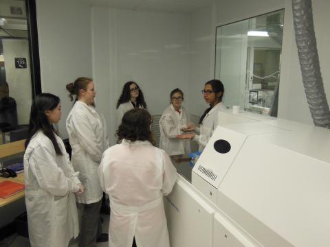 Students in PCIGR lab in white lab coats